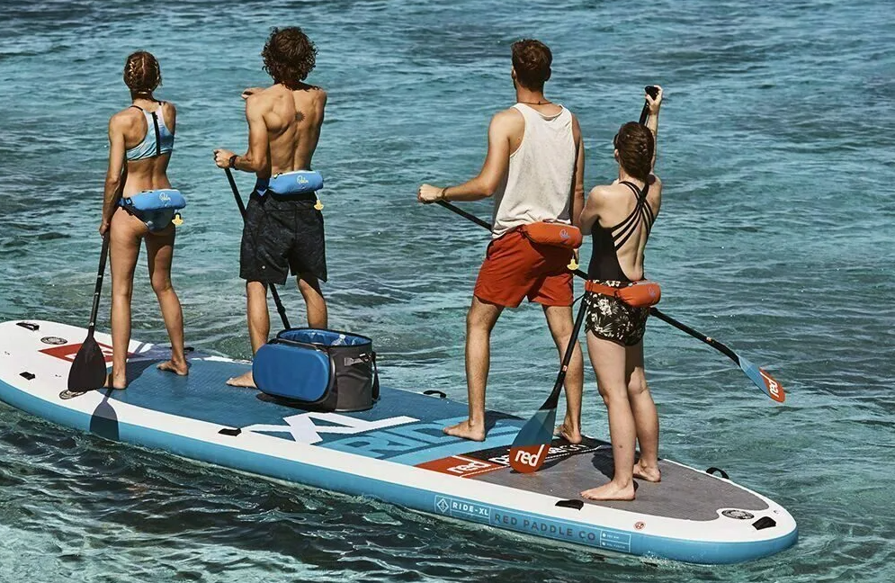 Local SUP guide preparing boards on the Palma promenade